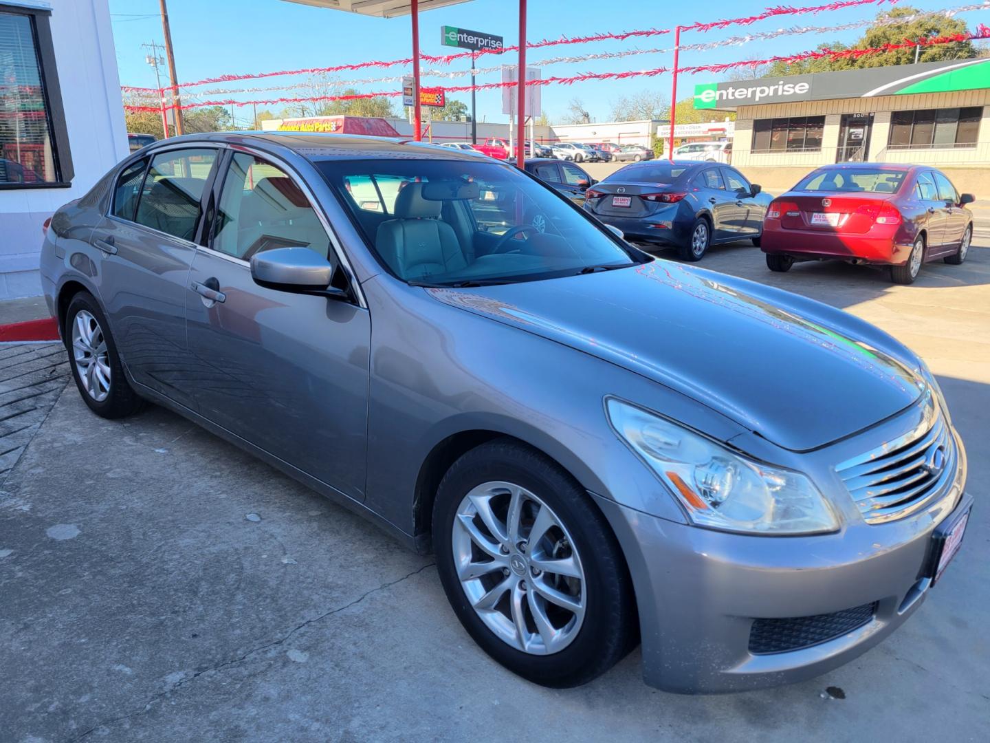 2009 GRAY Infiniti G Sedan G37 (JNKCV61E29M) with an 3.7L V6 DOHC 24V engine, 5-Speed Automatic transmission, located at 503 West Court, Seguin, TX, 78155, (830) 379-3373, 29.568621, -97.969803 - Photo#1